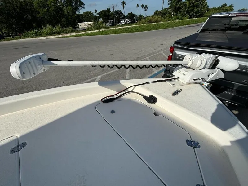 Slide: The Image of 2014 ShearWater 25LTZ boat with Minn Kota trolling motor in parking lot. - 9