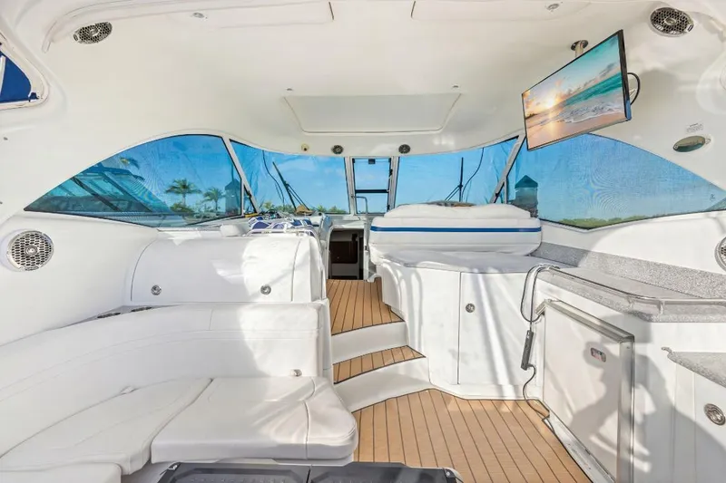 Slide: The Image of Luxurious interior of a 2007 Formula 45 Yacht with white seating and wood flooring. - 13