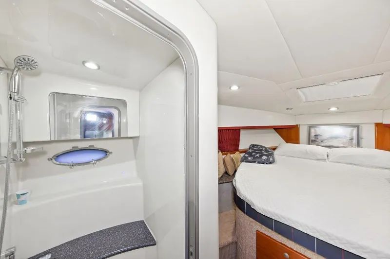 Slide: The Image of Luxurious 2007 Formula 45 Yacht interior with cozy bedroom and modern bathroom. - 18