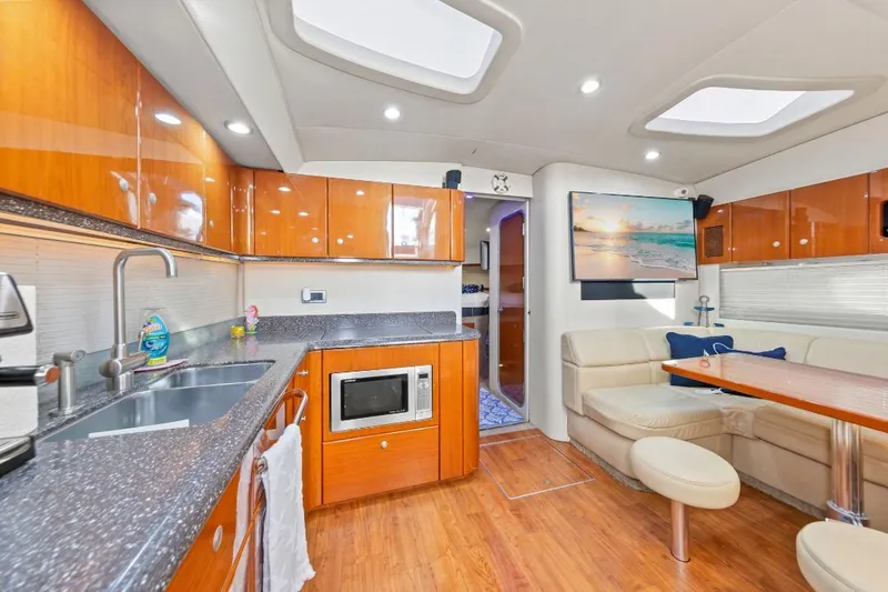 Slide: The Image of Luxurious interior of a 2007 Formula 45 Yacht with modern kitchen and seating area. - 20