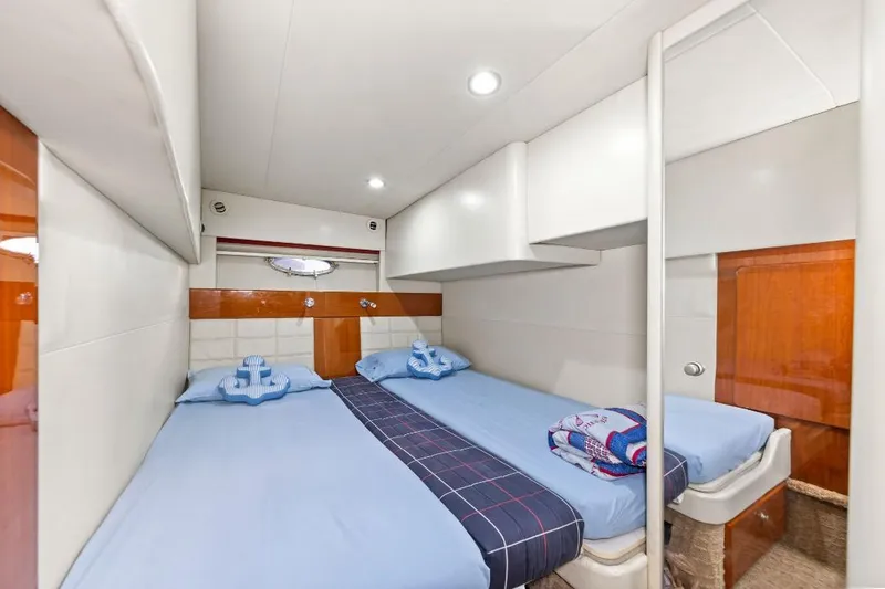Slide: The Image of Interior cabin of 2007 Formula 45 Yacht with twin beds and nautical decor. - 4