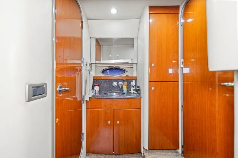 Slide: The Image of Luxurious 2007 Formula 45 Yacht bathroom with wooden cabinetry and modern fixtures. - 5