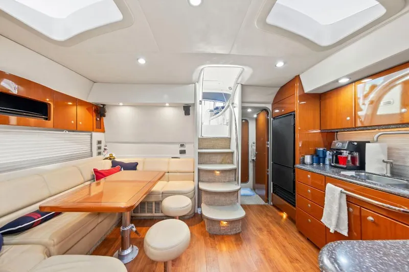 Slide: The Image of Luxurious interior of a 2007 Formula 45 Yacht with modern kitchen and seating area. - 6