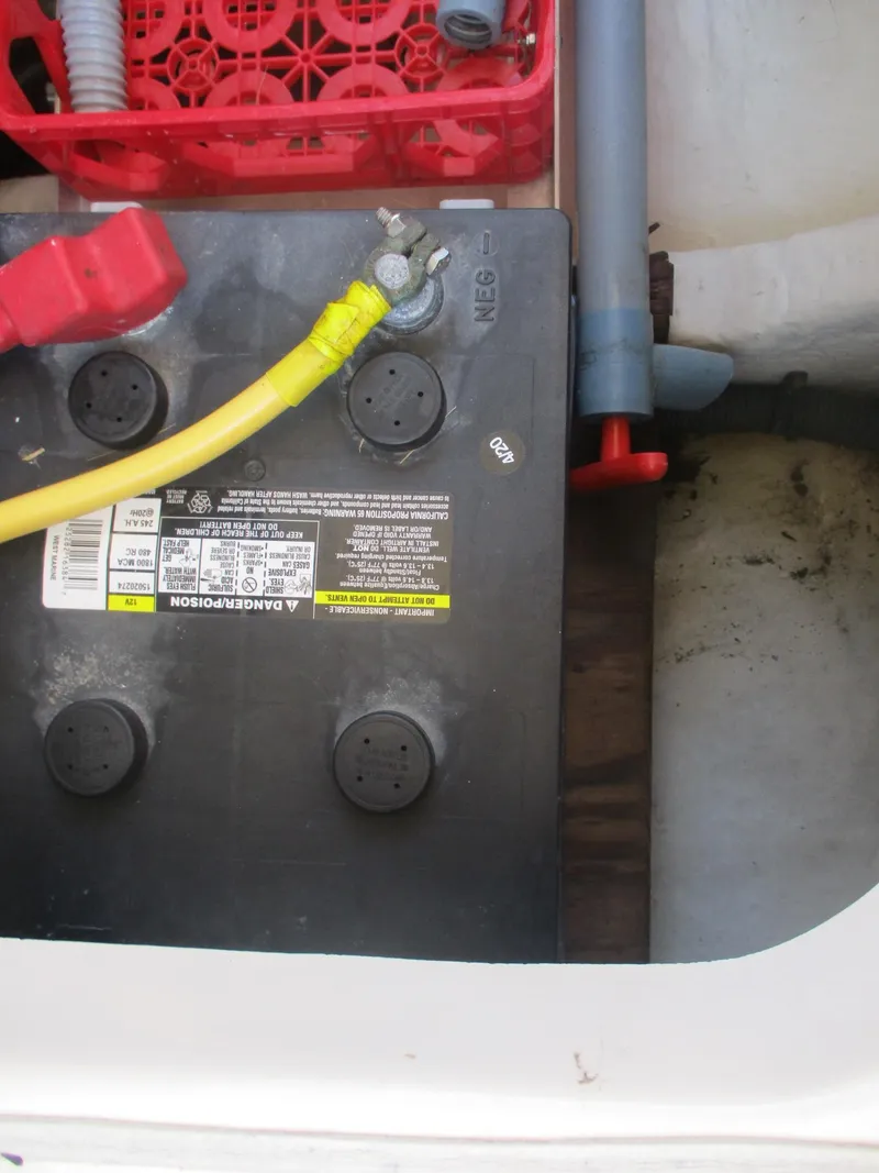 Slide: The Image of Battery compartment of 2007 Mainship Pilot 34 Sedan with visible wiring and components. - 22