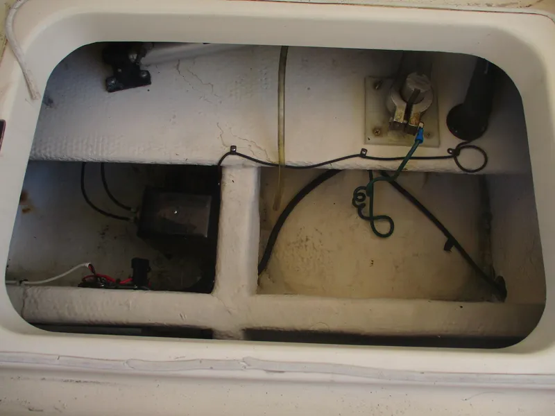 Slide: The Image of 2007 Mainship Pilot 34 Sedan engine compartment with wiring and components. - 23