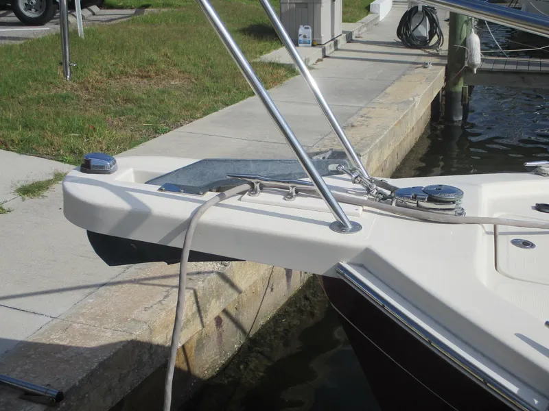 Slide: The Image of 2007 Mainship Pilot 34 Sedan bow with docked mooring lines and stainless steel fittings. - 34