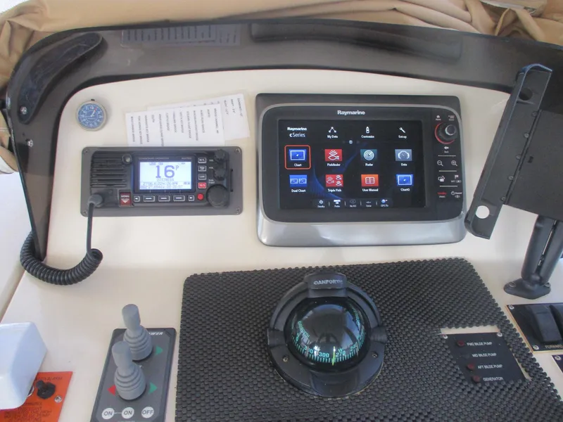 Slide: The Image of 2007 Mainship Pilot 34 Sedan dashboard with navigation and communication equipment. - 5