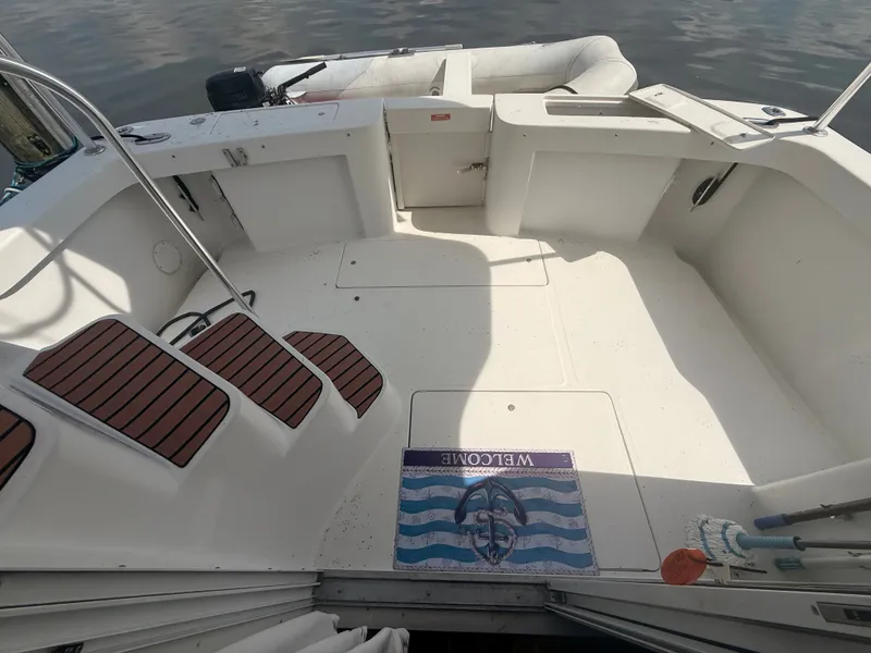 Slide: The Image of 2000 Mainship 390 Trawler deck with welcome mat and seating area. - 15