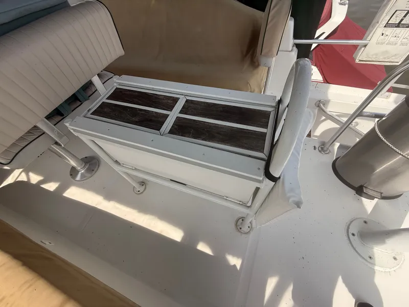 Slide: The Image of 2000 Mainship 390 Trawler deck with seating and storage area. - 31