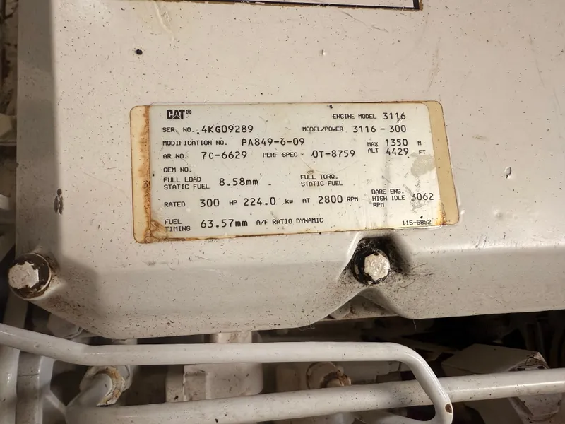 Slide: The Image of Engine label on 2000 Mainship 390 Trawler, CAT model 3116, 300 HP specifications. - 46