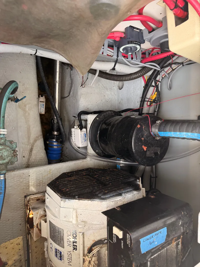 Slide: The Image of Engine room of 2000 Mainship 390 Trawler with visible wiring and components. - 48