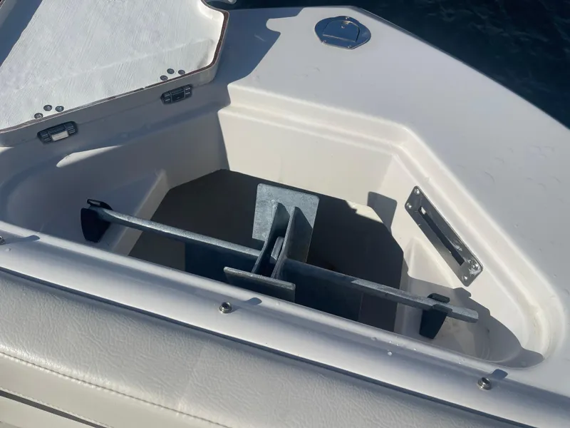 Slide: The Image of Anchor storage compartment on 2023 Sailfish 245 DC boat. - 11