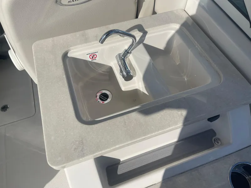 Slide: The Image of 2023 Sailfish 245 DC boat sink with modern faucet and countertop. - 35