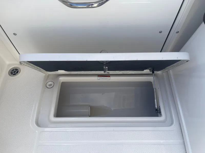Slide: The Image of Open storage compartment on 2023 Sailfish 245 DC boat. - 40