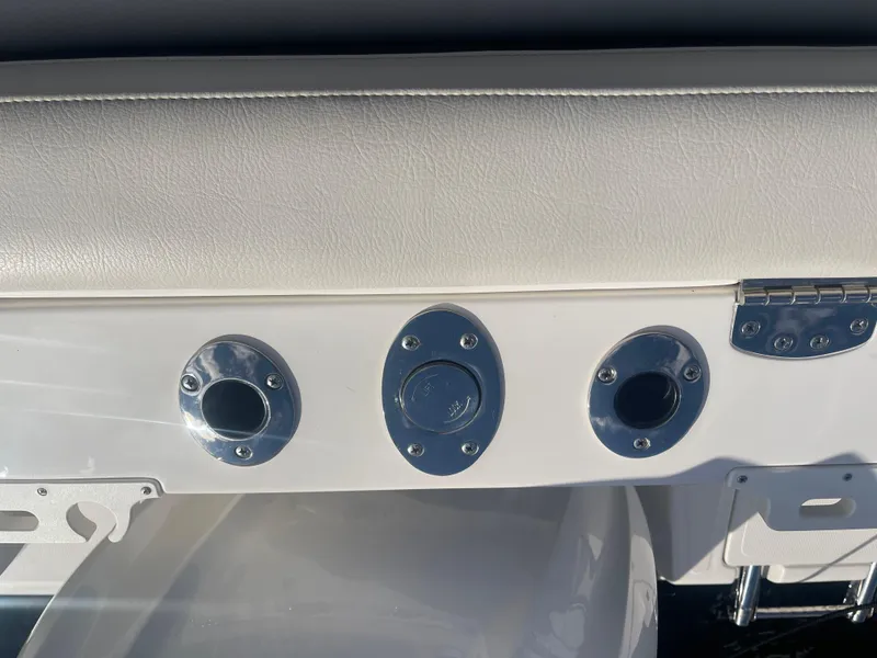 Slide: The Image of Rod holders on a 2023 Sailfish 245 DC boat, featuring sleek chrome finishes. - 44
