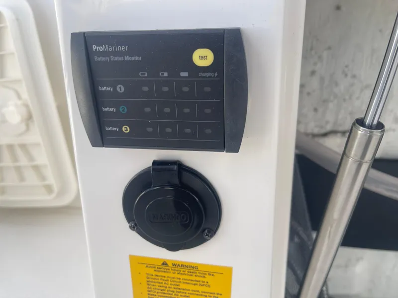 Slide: The Image of Battery status monitor on 2023 Sailfish 245 DC boat dashboard. - 46