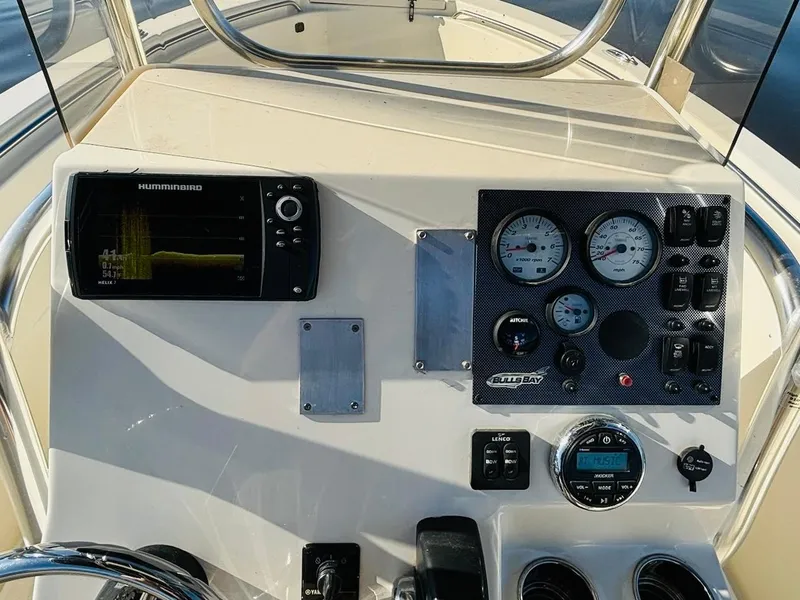 Slide: The Image of 2017 Bulls Bay 230 Center Console dashboard with gauges and navigation system. - 15