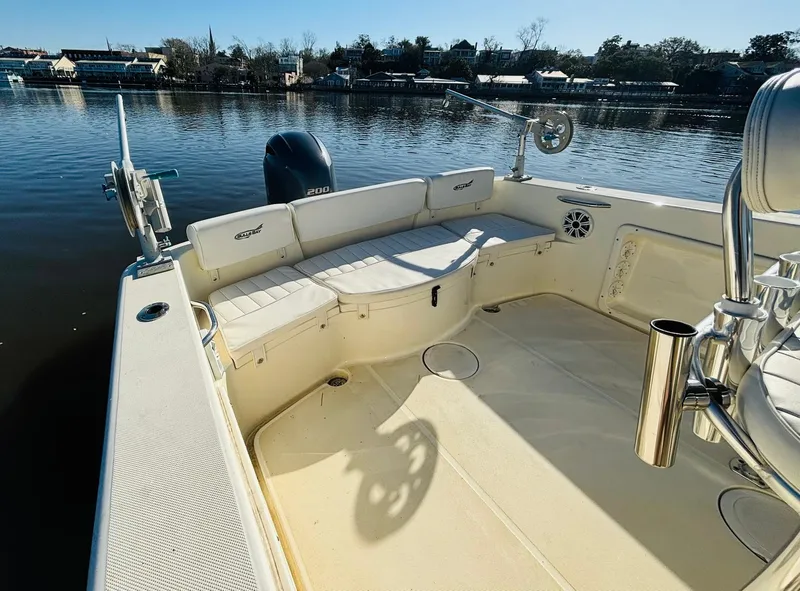 Slide: The Image of 2017 Bulls Bay 230 Center Console boat interior with seating, on calm water. - 8
