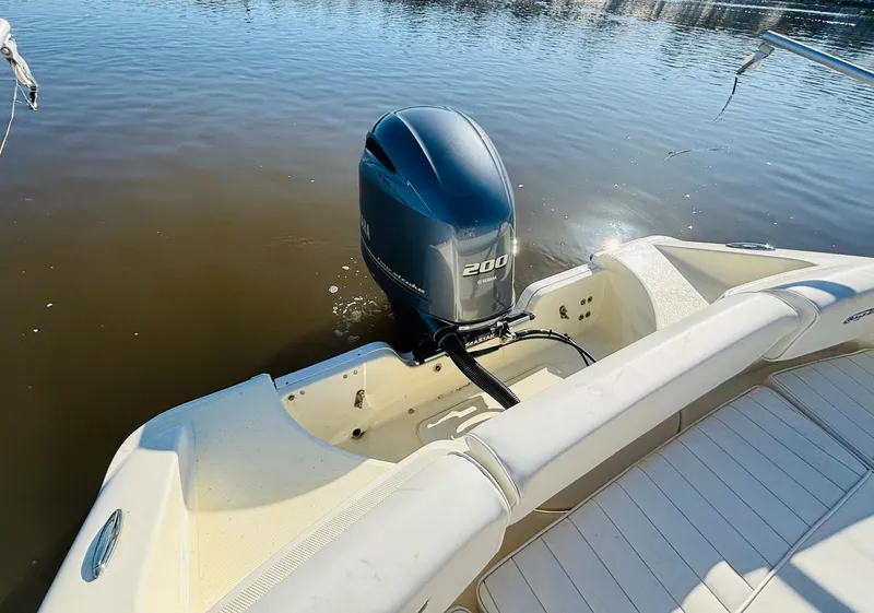 Slide: The Image of 2017 Bulls Bay 230 Center Console boat with 200 HP outboard motor on calm water. - 9