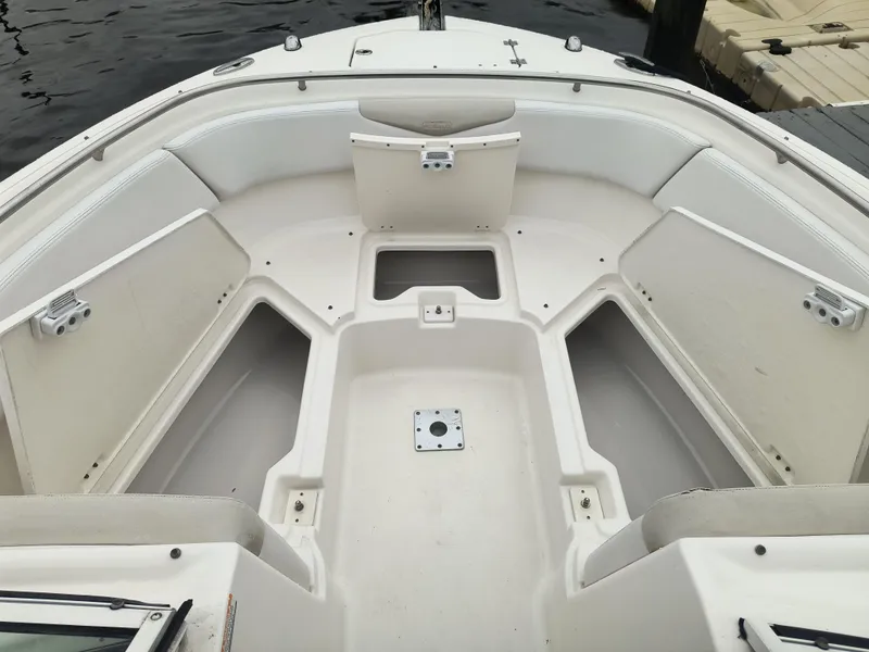 Slide: The Image of 2016 Robalo R247 Dual Console boat interior with spacious seating and storage. - 10