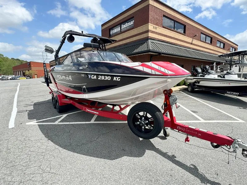 Slide: The Image of 2021 Moomba Mojo boat on trailer in parking lot, near Yamaha Indmar building. - 1