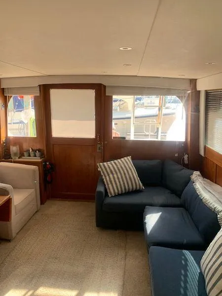 Slide: The Image of Interior of 1984 Post Convertible yacht with cozy seating and nautical decor. - 13