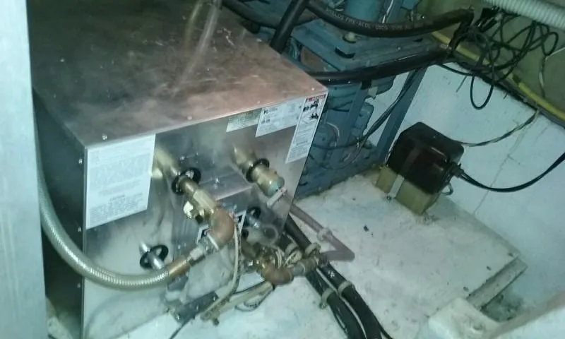 Slide: The Image of 1984 Post Convertible engine room with mechanical components and wiring. - 23