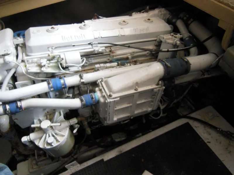 Slide: The Image of Engine of a 1984 Post Convertible boat, showcasing intricate mechanical components. - 25