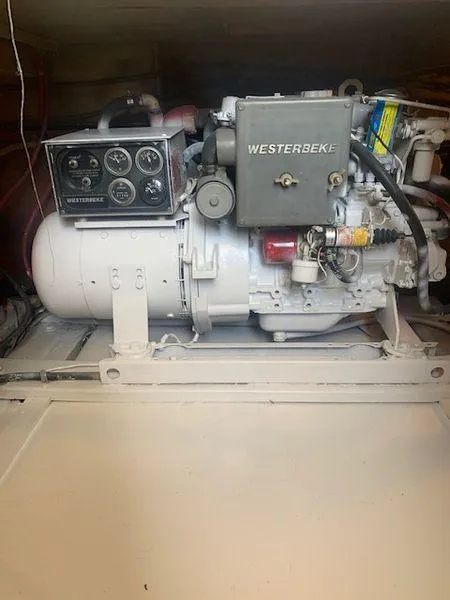 Slide: The Image of Westerbeke engine in a 1984 Post Convertible, showcasing gauges and components. - 26