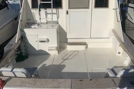 Slide: The Image of 1984 Post Convertible boat deck, spacious and well-maintained, great deal opportunity. - 3