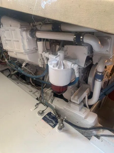 Slide: The Image of 1984 Post Convertible engine compartment with visible pipes and components. - 30