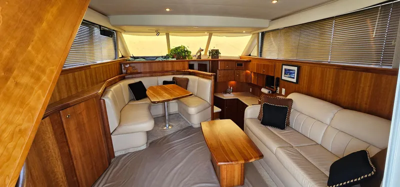 Slide: The Image of Luxurious interior of 2003 Silverton 42 Convertible yacht with elegant wood and leather furnishings. - 28