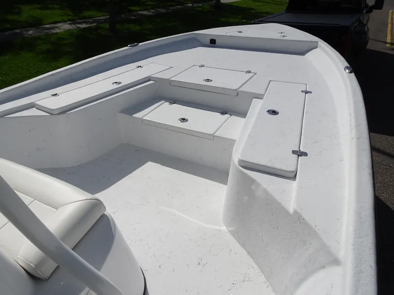 Slide: The Image of 2019 Blazer Bay 2400 boat interior with seating and storage compartments. - 13
