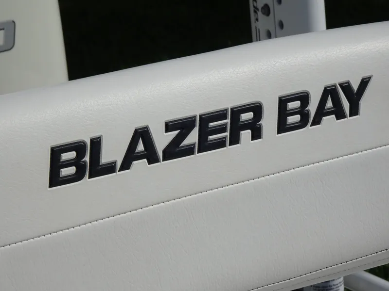 Slide: The Image of Blazer Bay 2400 logo on white surface, 2019 model boat detail. - 21
