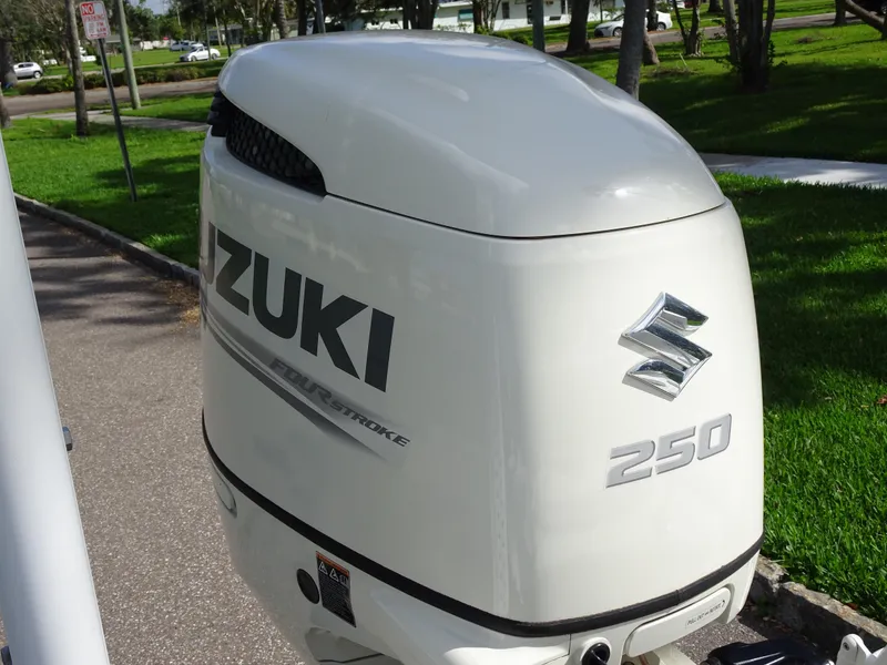 Slide: The Image of White Suzuki 250 outboard motor on a 2019 Blazer Bay 2400 boat. - 24