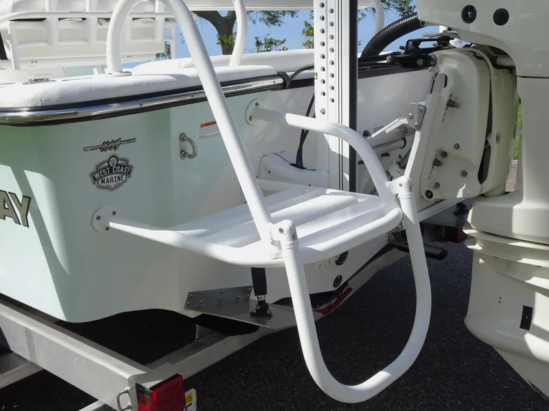 Slide: The Image of 2019 Blazer Bay 2400 boat with ladder and motor, on a trailer. - 28
