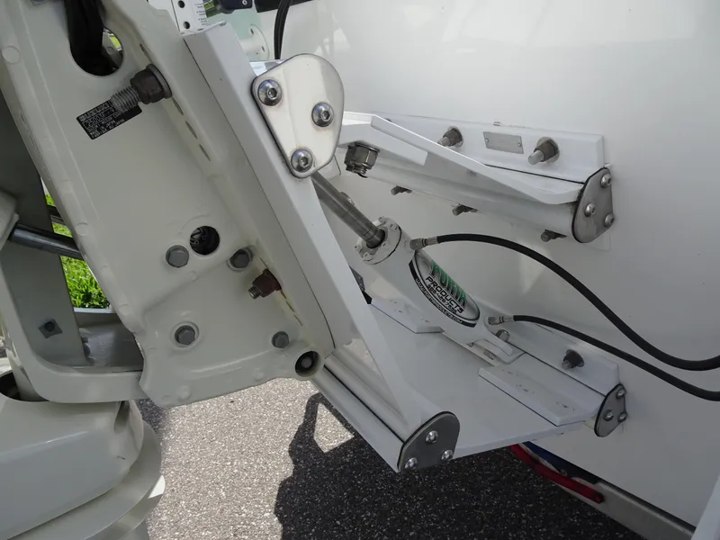 Slide: The Image of Close-up of 2019 Blazer Bay 2400 boat engine mount and hydraulic system. - 29