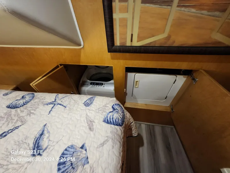 Slide: The Image of Interior of 1999 Navigator 4800 CLASSIC yacht with wooden finish and cozy bedroom. - 21