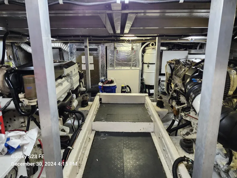 Slide: The Image of Luxury yacht deck with white seating, Navigator 4800 CLASSIC, 1999 model, docked at marina. - 41