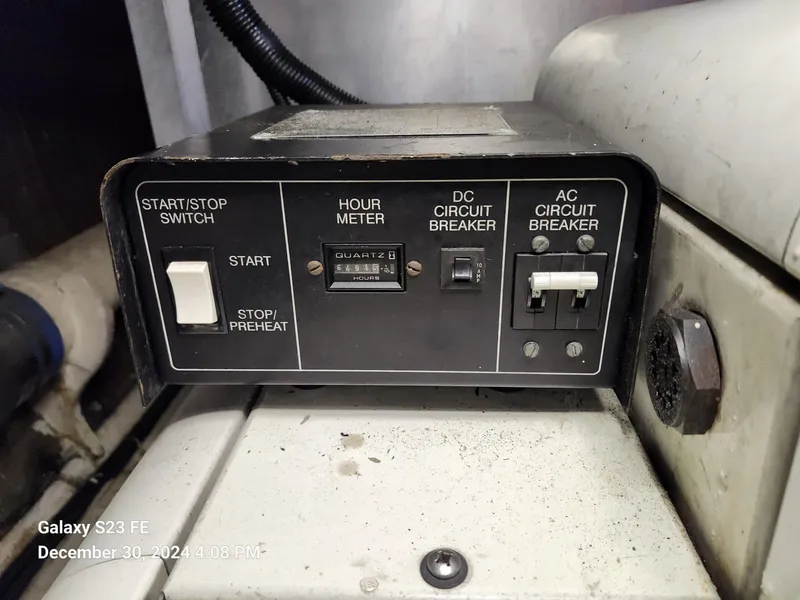 Slide: The Image of Control panel of a 1999 Navigator 4800 CLASSIC with switches and circuit breakers. - 48
