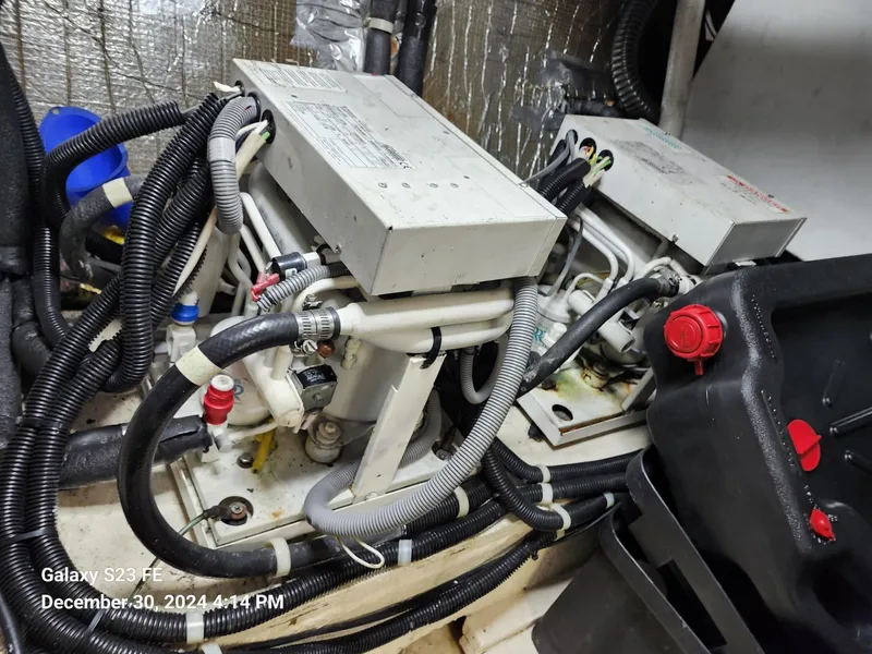 Slide: The Image of Engine room of 1999 Navigator 4800 CLASSIC with mechanical components and wiring. - 49