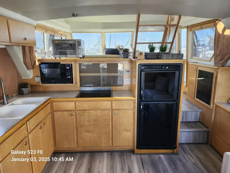 Slide: The Image of 1999 Navigator 4800 CLASSIC yacht named "Knot Done" docked in El Paso, TX. - 5