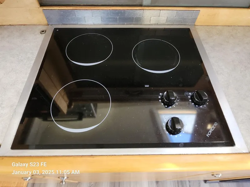 Slide: The Image of Spacious kitchen in 1999 Navigator 4800 CLASSIC yacht with modern appliances and wood cabinetry. - 9