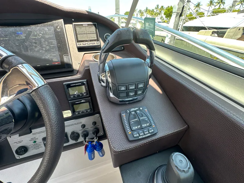 Slide: The Image of Control panel of a 2015 Regal 32 Express boat with navigation equipment. - 12