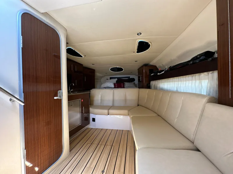 Slide: The Image of Luxurious interior of 2015 Regal 32 Express yacht with plush seating and wood accents. - 14