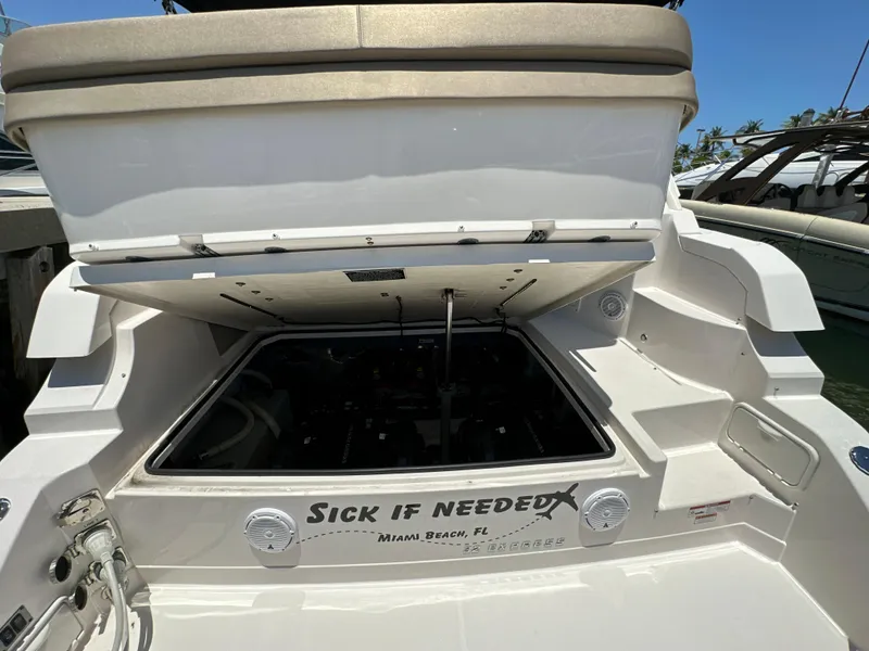Slide: The Image of 2015 Regal 32 Express boat with open engine compartment, Miami Beach, FL. - 27