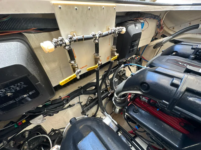 Slide: The Image of Engine compartment of a 2015 Regal 32 Express boat, featuring Volvo Penta components. - 31