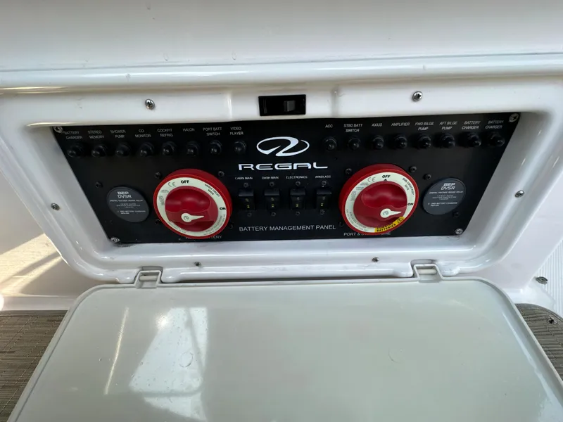Slide: The Image of 2015 Regal 32 Express battery management panel with control switches and dials. - 33