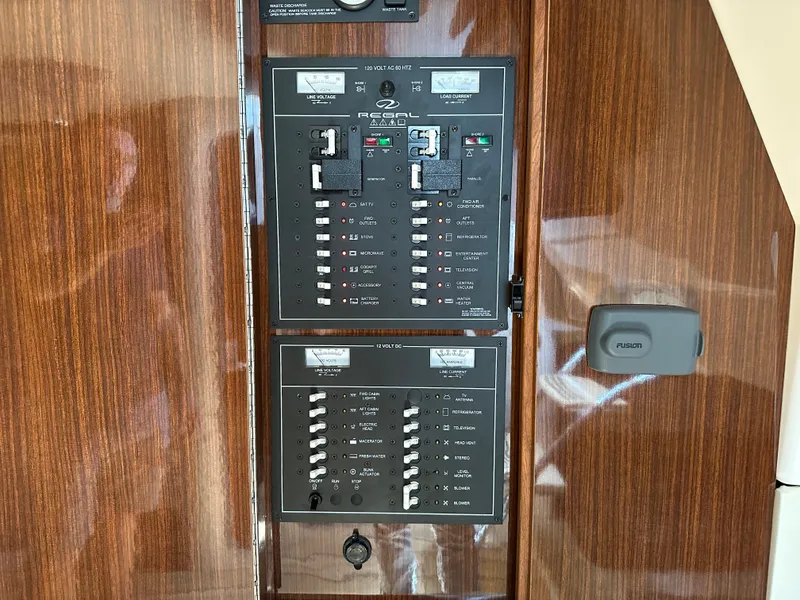 Slide: The Image of Control panel of a 2015 Regal 32 Express boat with wood finish. - 34