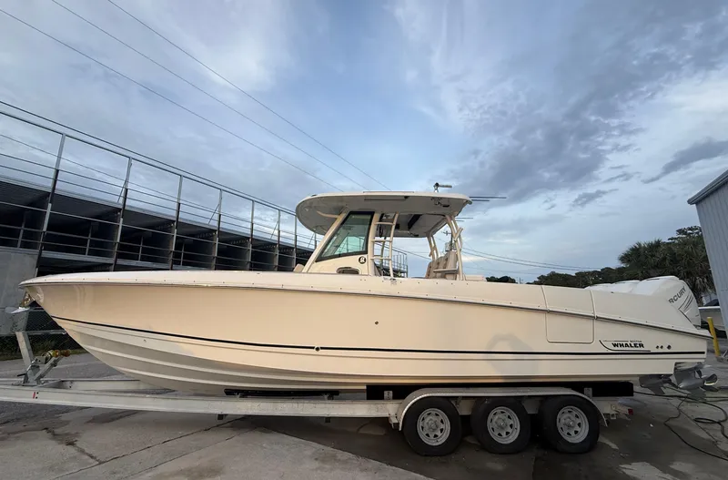 Slide: The Image of 2017 Boston Whaler 350 Outrage boat on trailer, side view. - 0